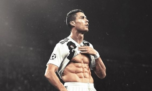Cristiano Ronaldo showing his body abs to the crowd in the stands