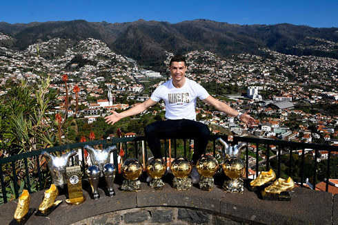 Cristiano Ronaldo showing off his individual trophies