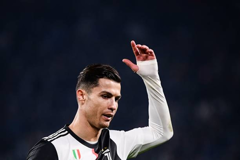 Cristiano Ronaldo raises his arm in protest for being subbed off
