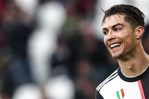 Cristiano Ronaldo smiling in a Juventus jersey