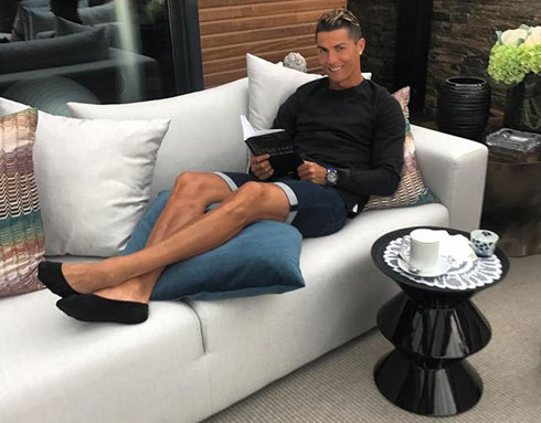 Cristiano Ronaldo resting and reading a book