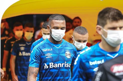 Football players wearing masks during a game