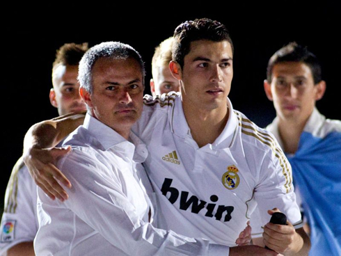 Mourinho and Ronaldo hugging after winning a title for Real Madrid
