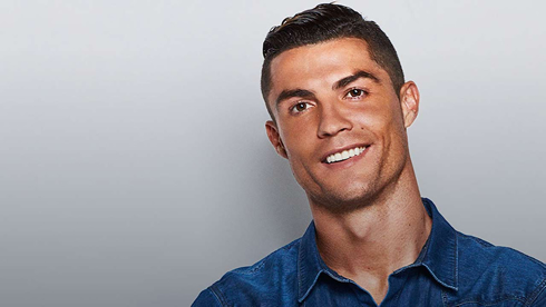 Cristiano Ronaldo smiling to the camera in a photoshoot session