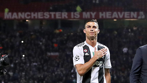 Cristiano Ronaldo tapping his heart during a Juventus game at Old Trafford