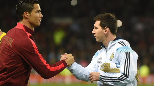 Cristiano Ronaldo and Messi greeting each other before a game