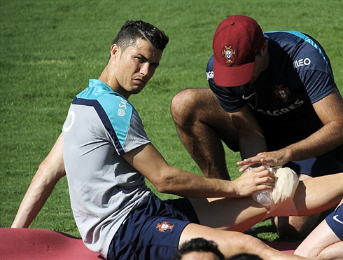 Cristiano Ronaldo receiving treatment on his left knee