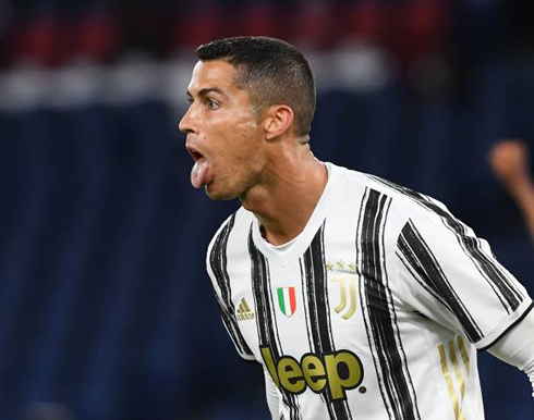 Cristiano Ronaldo celebrates his goal vs AS Roma with his tongue out