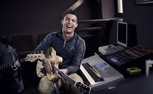 Cristiano Ronaldo playing guitar in a music set