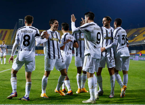 Juventus players gather up after a goal