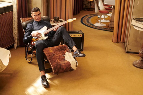 Cristiano Ronaldo playing the guitar