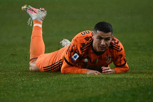 Cristiano Ronaldo lays down on the ground