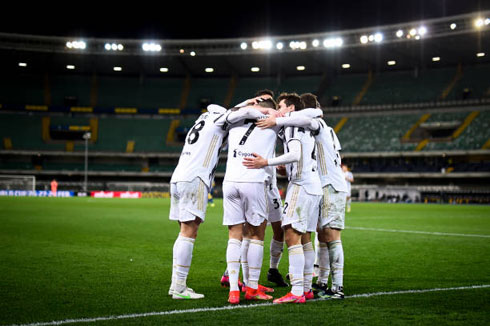 Juventus players gather around after a goal