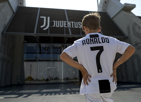 A young fan wearing Ronaldo Juventus shirt