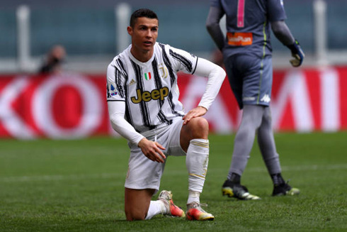 Cristiano Ronaldo down on one knee