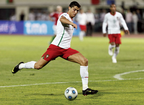 Cristiano Ronaldo playing for Portugal in a white jersey