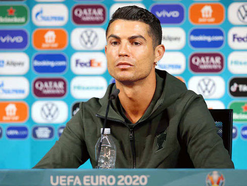 Cristiano Ronaldo attending Portugal press conference with a bottle of water in front of him