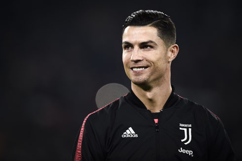 Cristiano Ronaldo wearing black Juventus shirt