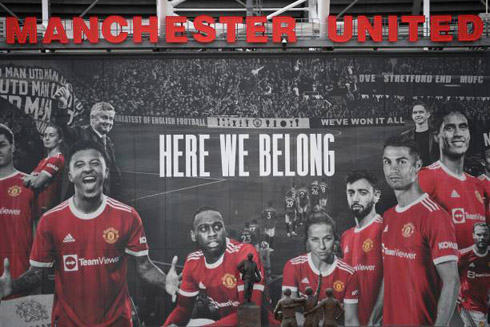 Cristiano Ronaldo at Old Trafford with stadium poster in 2021