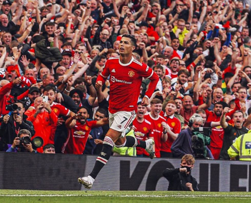 Cristiano Ronaldo running with the Old Trafford crowd cheering behind