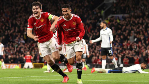 Cristiano Ronaldo and Maguire running to the fans