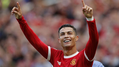 Cristiano Ronaldo raising his hands after scoring for Man United
