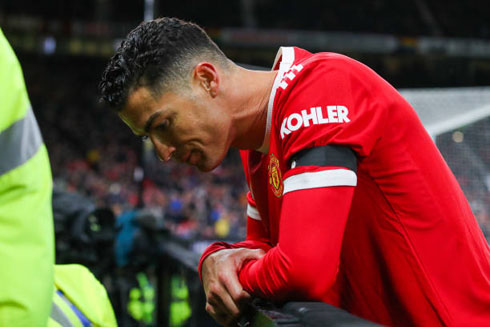 Cristiano Ronaldo next to an advertising board