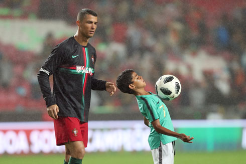 Cristiano Ronaldo watching his son controlling the ball