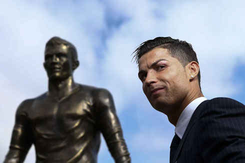 Cristiano Ronaldo next to his statue in Madeira