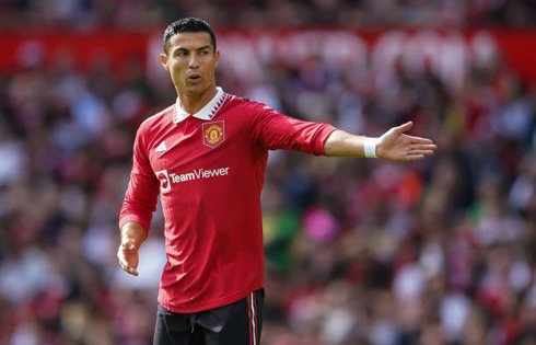 Cristiano Ronaldo stretching his arm during United game