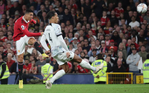 Cristiano Ronaldo shooting with his left foot near Van Dijk