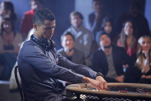 Cristiano Ronaldo hiding his game on a poker table
