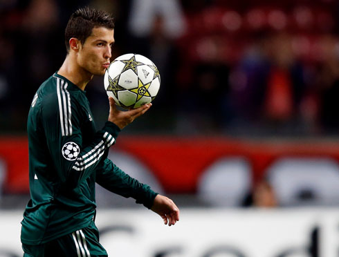 Cristiano Ronaldo kissing Champions League hat-trick ball