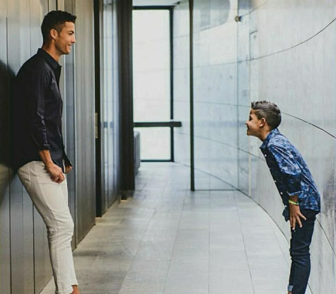 Cristiano Ronaldo and his son Cristiano Jr in one of their mansions