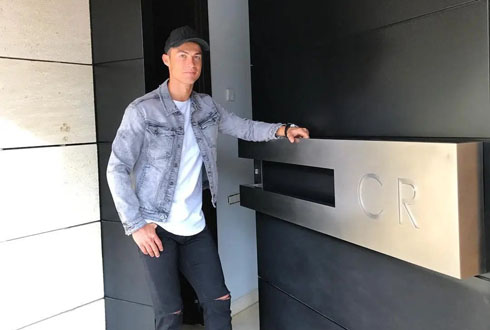 Cristiano Ronaldo opening the door to his home