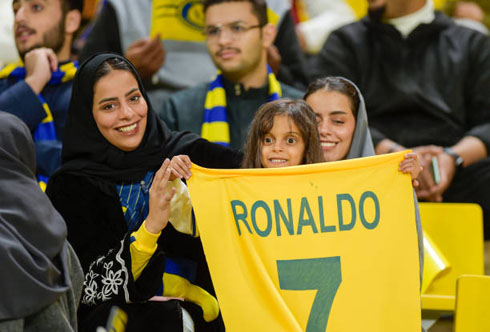 Saudi fans holding Cristiano Ronaldo shirt in Al Nassr stadium