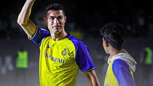 Cristiano Ronaldo and his son on the pitch for Al Nassr