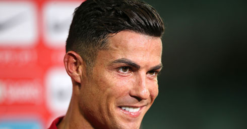 Cristiano Ronaldo smiling to the journalists