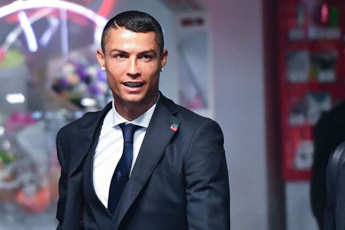 Cristiano Ronaldo wearing a suit and a tie