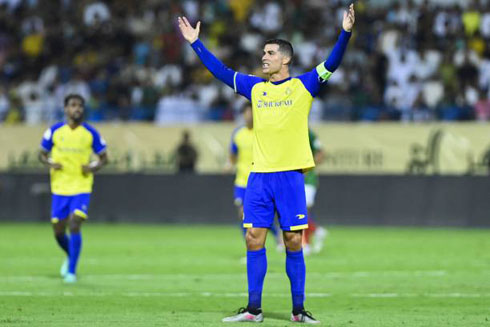 Cristiano Ronaldo playing for Al Nassr in yellow kit