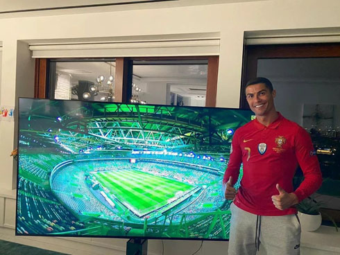 Cristiano Ronaldo next to a big TV screen