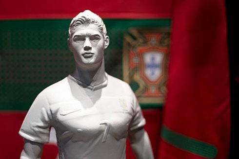 Cristiano Ronaldo statue in front of a Portugal shirt