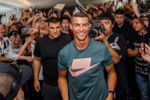 Cristiano Ronaldo surrounded by fans in China