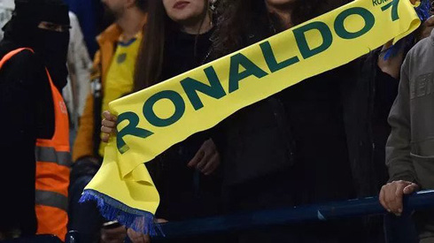 Cristiano Ronaldo scarf being held by a fan