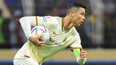 Cristiano Ronaldo taking the ball under his arm