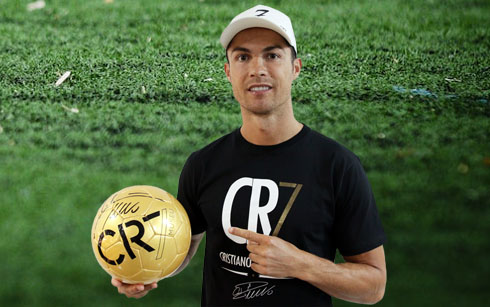 Cristiano Ronaldo and a CR7 ball signed by himself