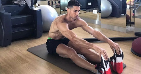 Cristiano Ronaldo doing stretches after training