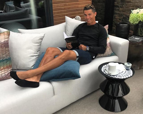 Cristiano Ronaldo relaxing reading a book