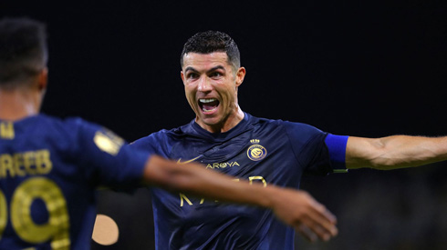 Cristiano Ronaldo playing for Al Nassr in blue shirt