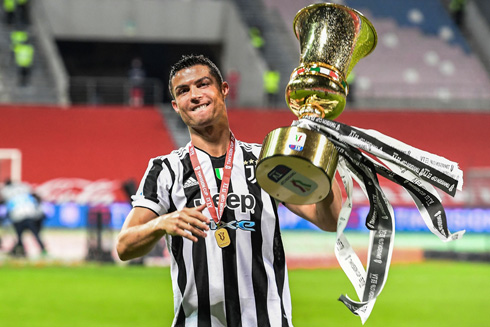 Cristiano Ronaldo lifting a trophy for Juventus